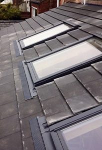 Velux skylight installation on tiled roof