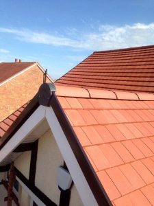 Professional tiled roofing installation with clay tiles